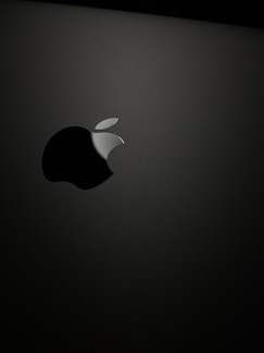 A sleek Apple product displayed on a minimalist background.