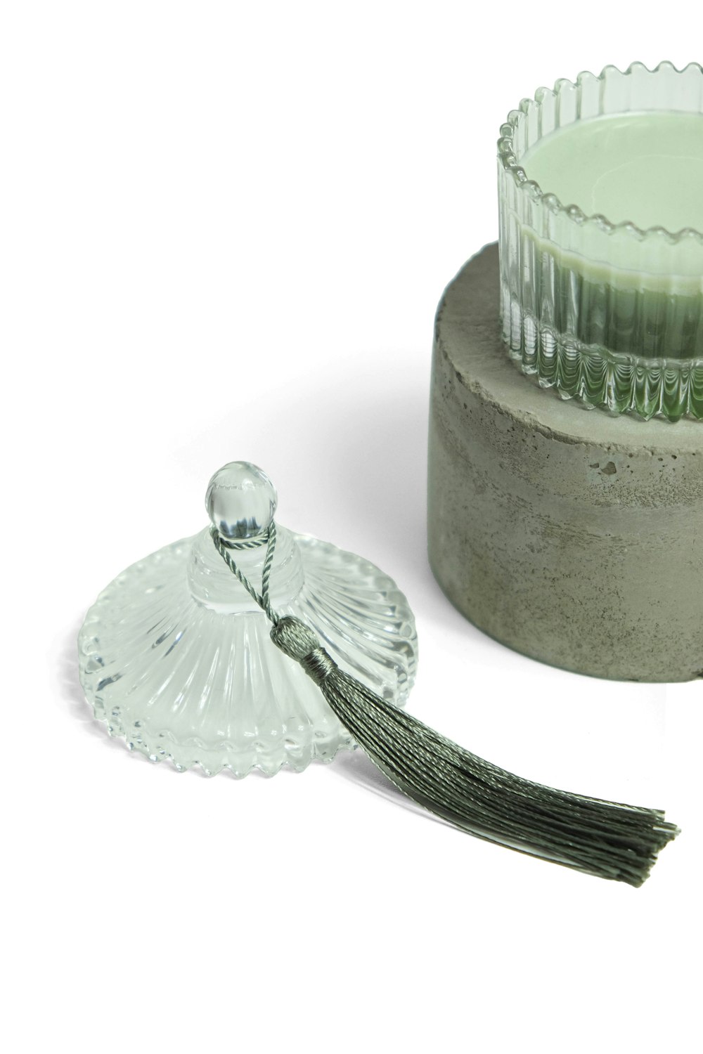 a candle holder with a glass candle on top of it