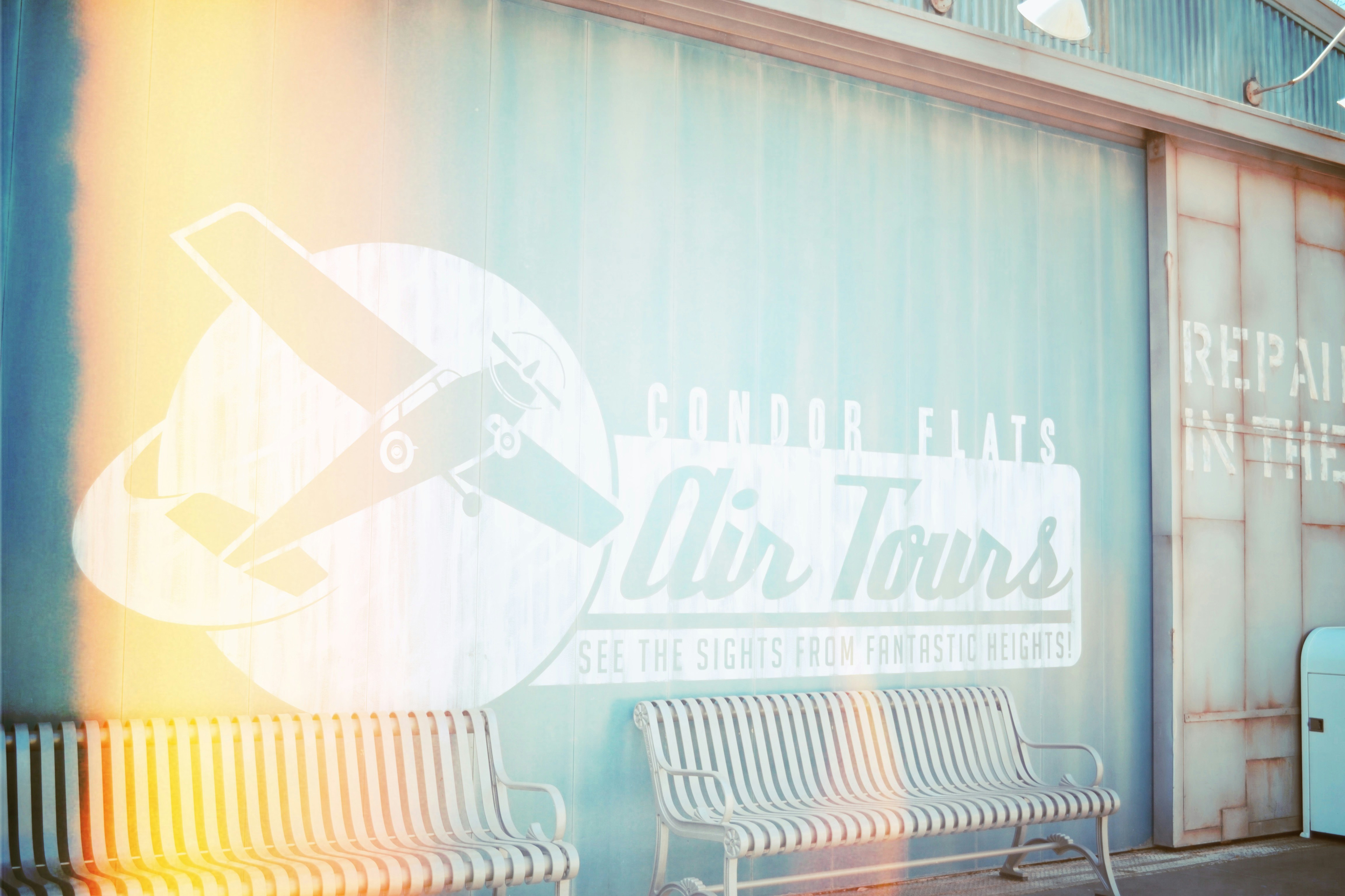 a couple of benches sitting in front of a building
