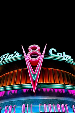 a neon sign on the side of a building