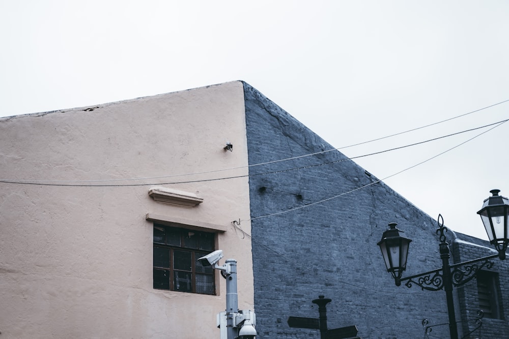 a tall building with a street light next to it