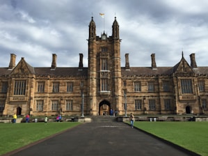 a large building with a long walkway in front of it