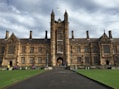 a large building with a long walkway in front of it