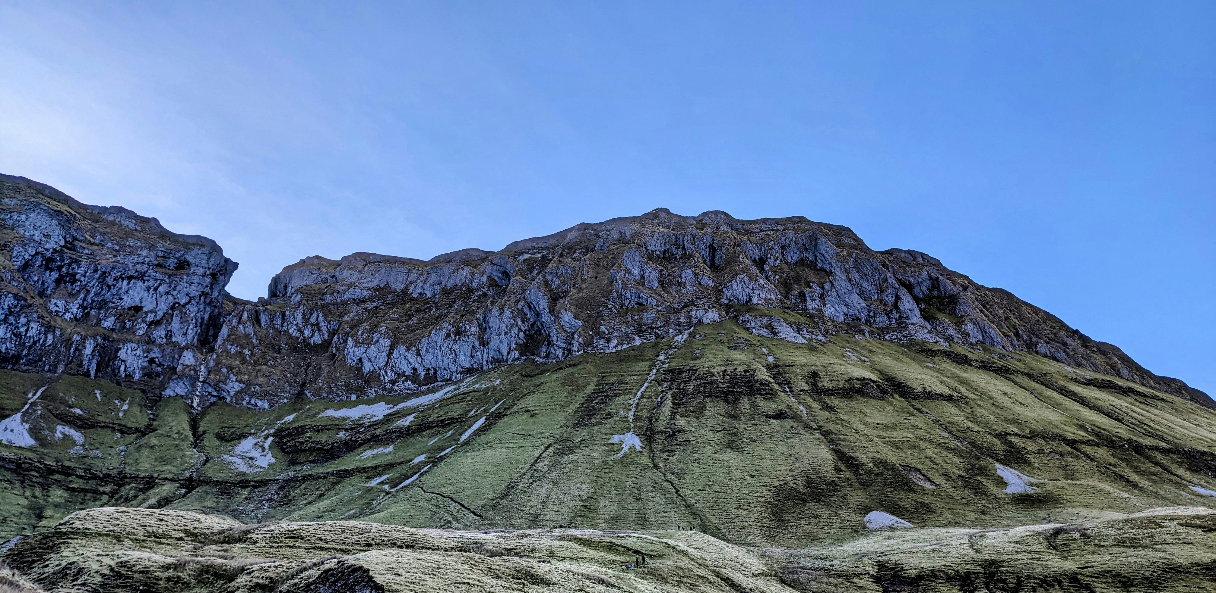 a very tall mountain with a sky background
