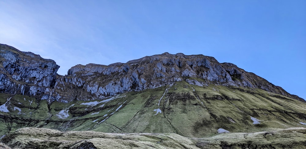 a very tall mountain with a sky background