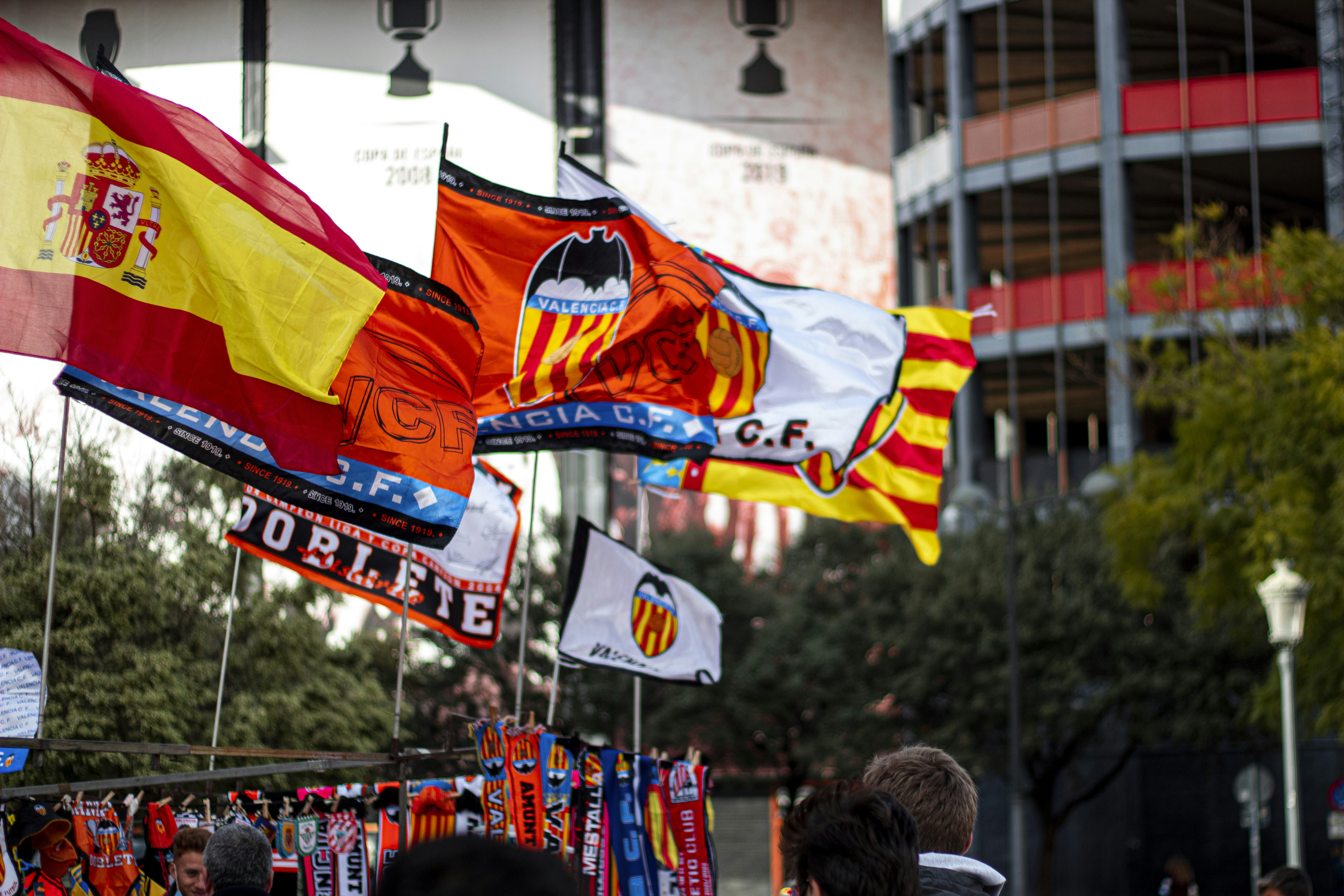 a bunch of flags that are flying in the air