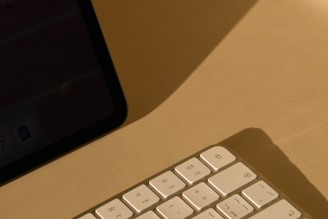 a computer keyboard sitting on top of a desk