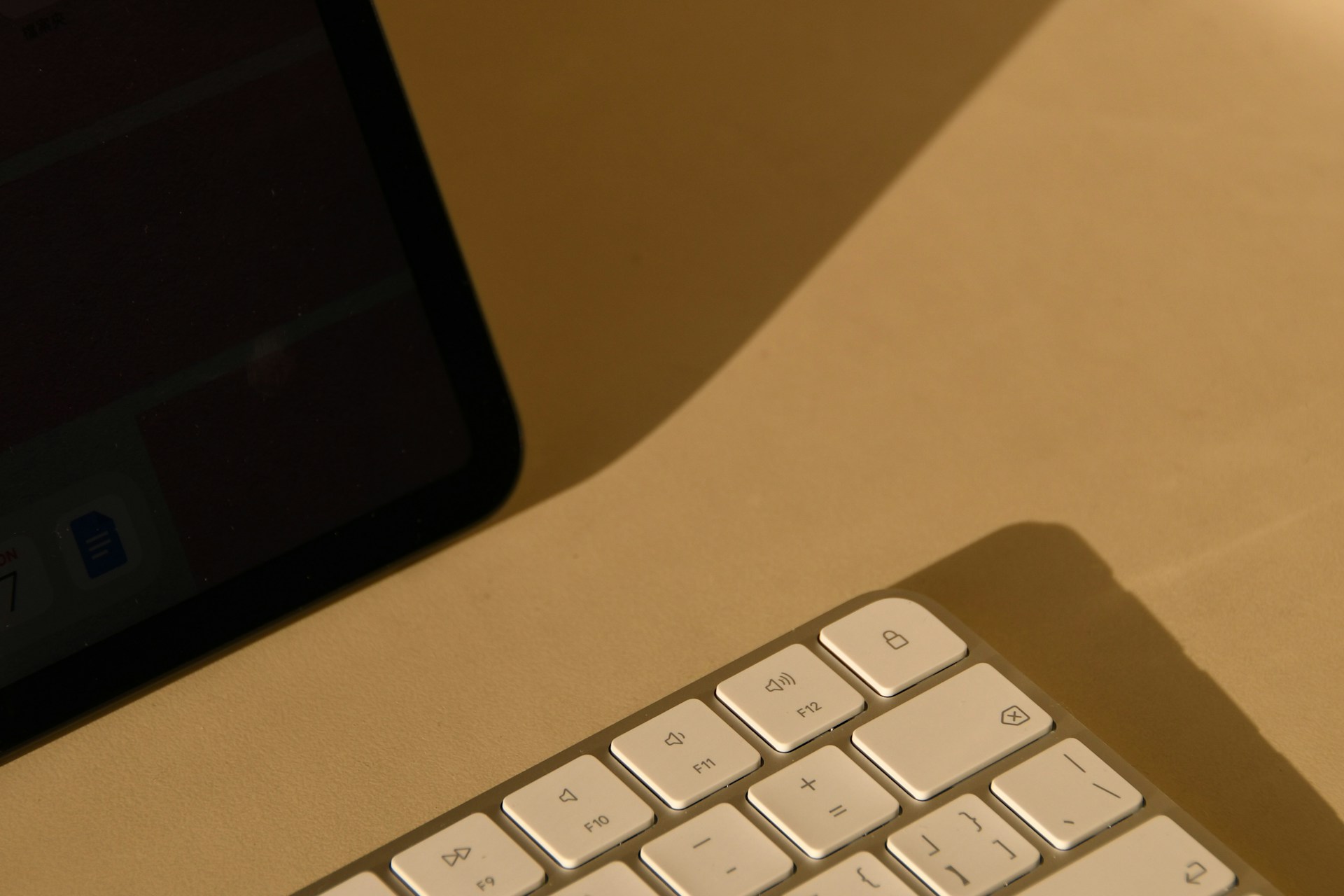 a computer keyboard sitting on top of a desk