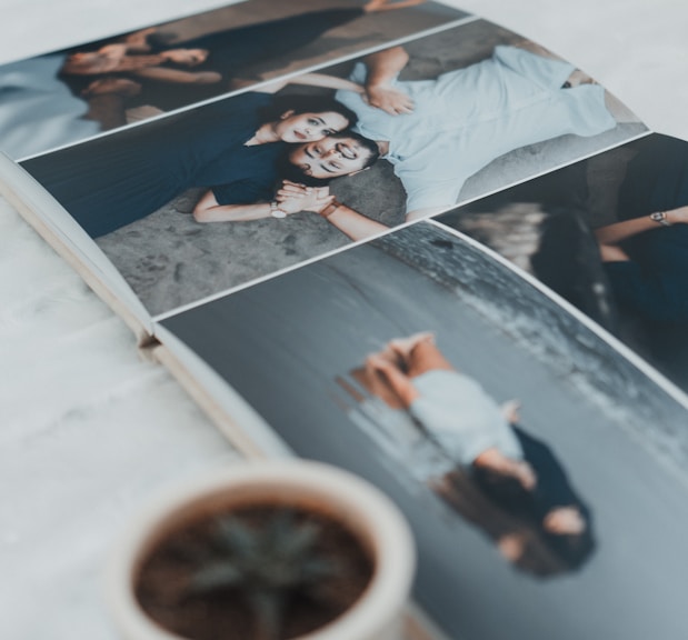 a photo book with four photos of people laying down