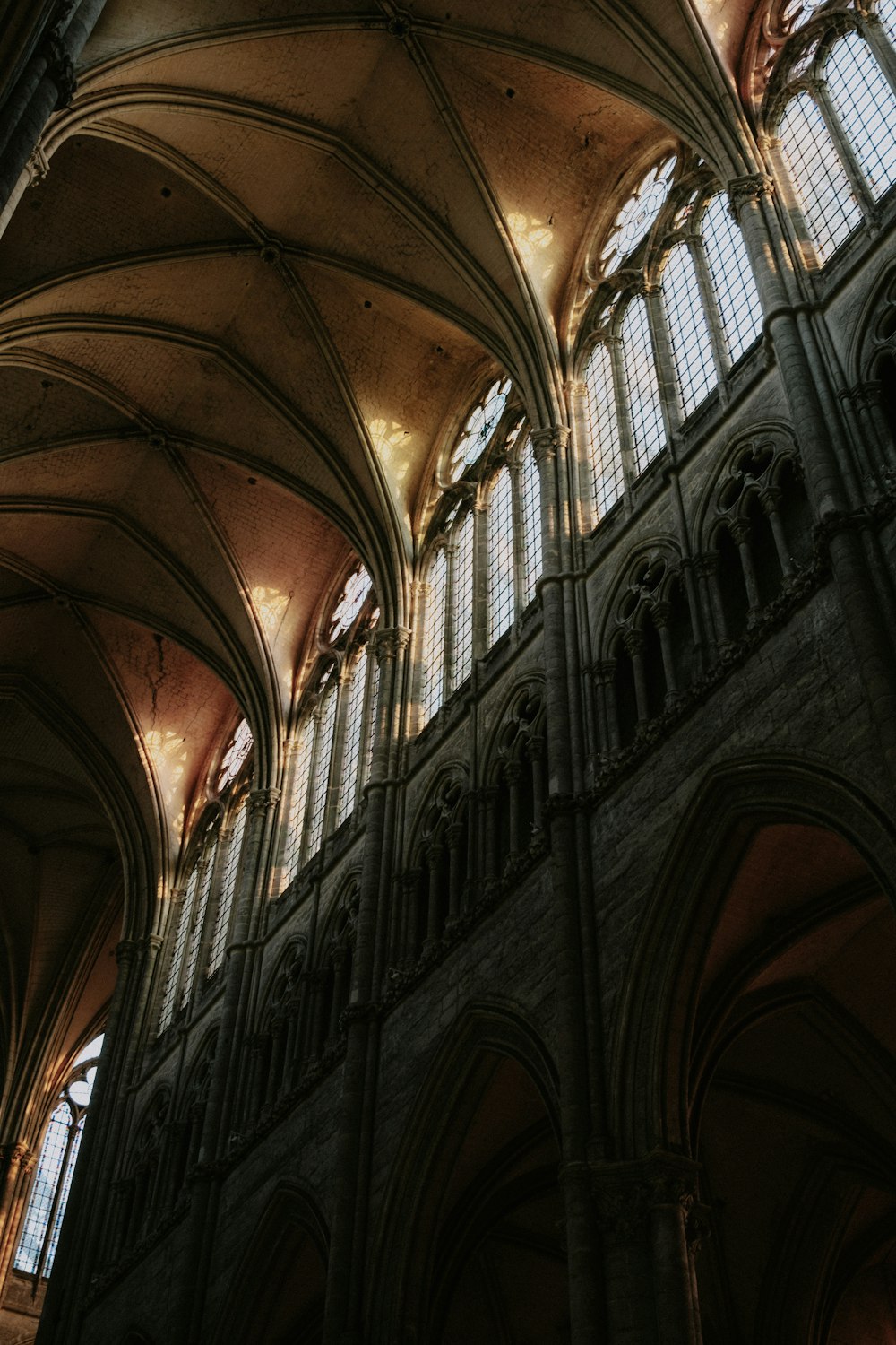 the ceiling of a large cathedral with many windows