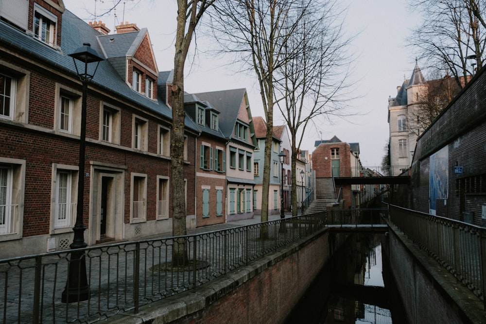 a canal running through a city next to tall buildings