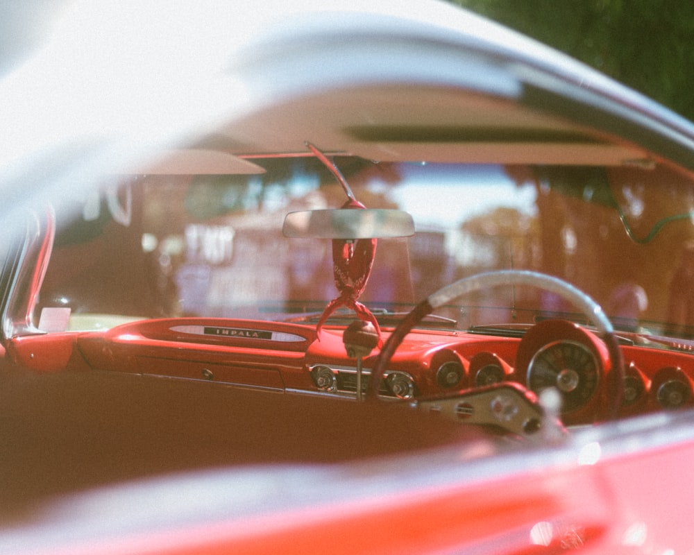 the interior of a car with a red interior