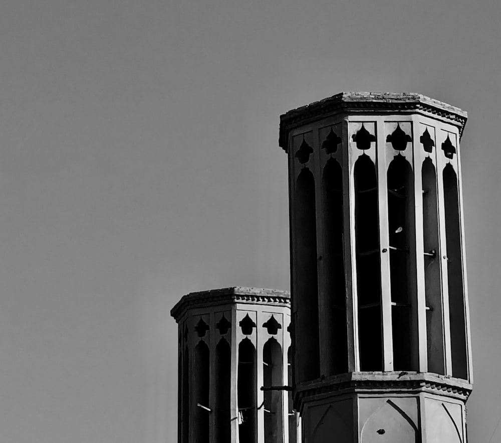 a black and white photo of a clock tower