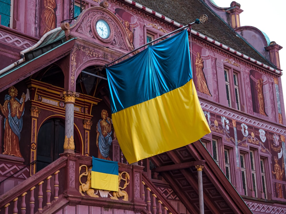 a large building with a flag hanging from it's side