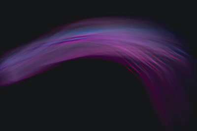 A sleek, glowing abstract shape radiating vibrant violet light against a deep charcoal background.