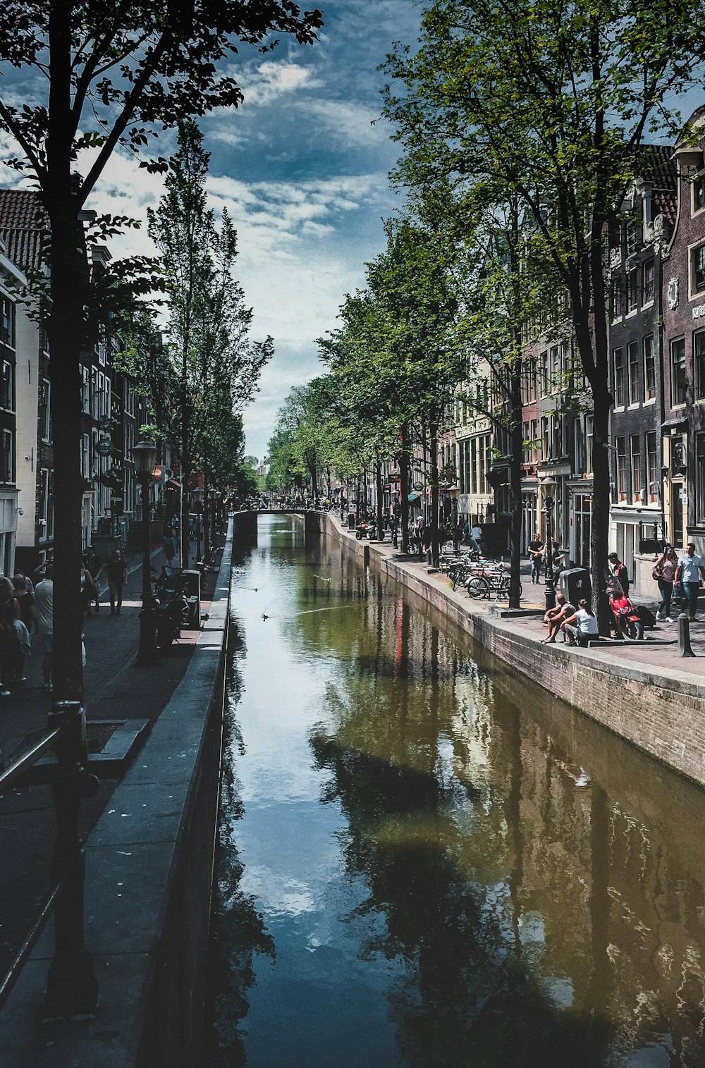 a river running through a city next to tall buildings