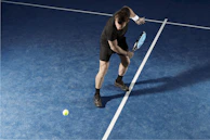 An action shot of a player mid-swing wearing Voltrex Sports apparel during a friendly match.