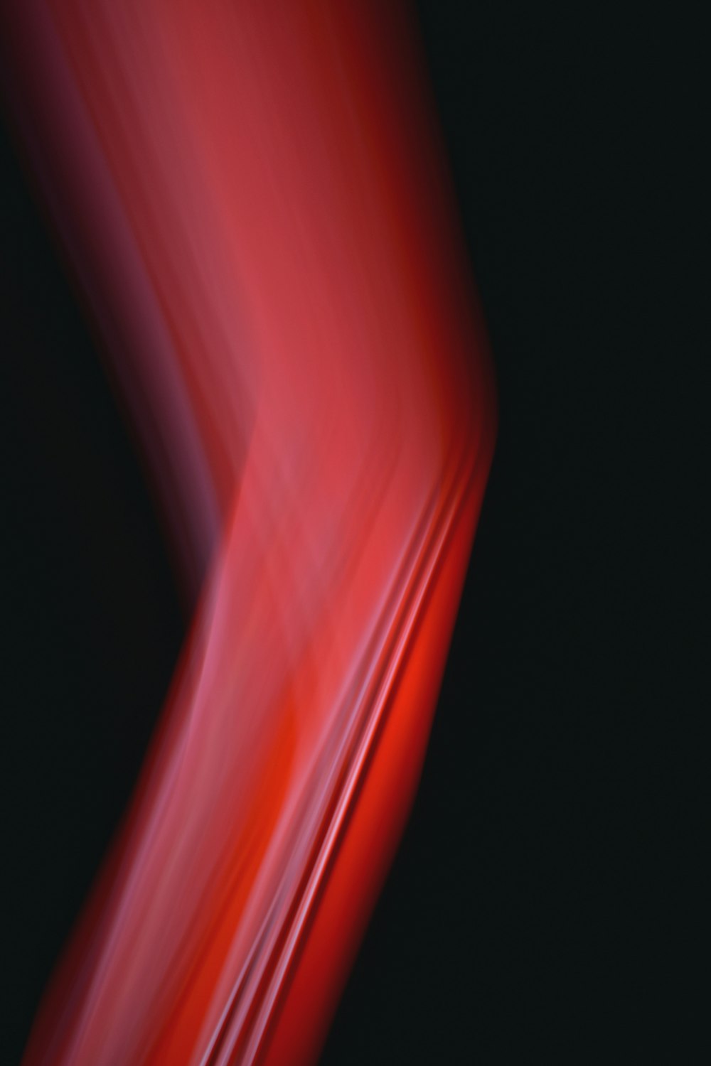 a blurry image of a red and black background
