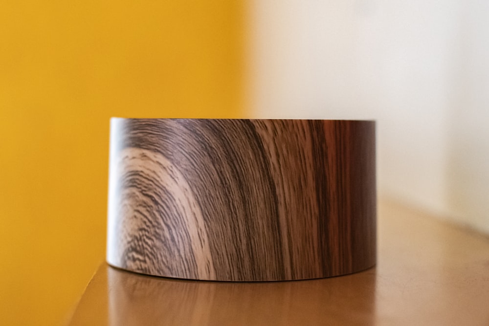 a close up of a wooden object on a table