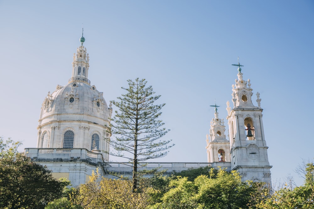 a church with two towers and a bell tower