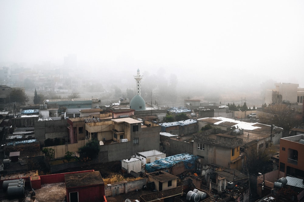 a view of a city in the fog