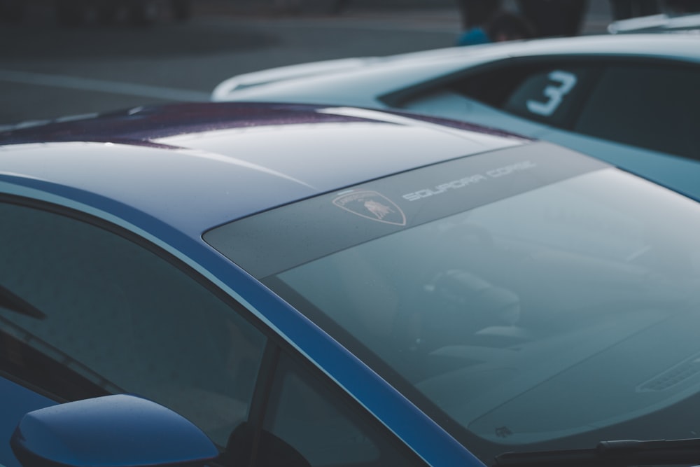 a close up of a car parked in a parking lot