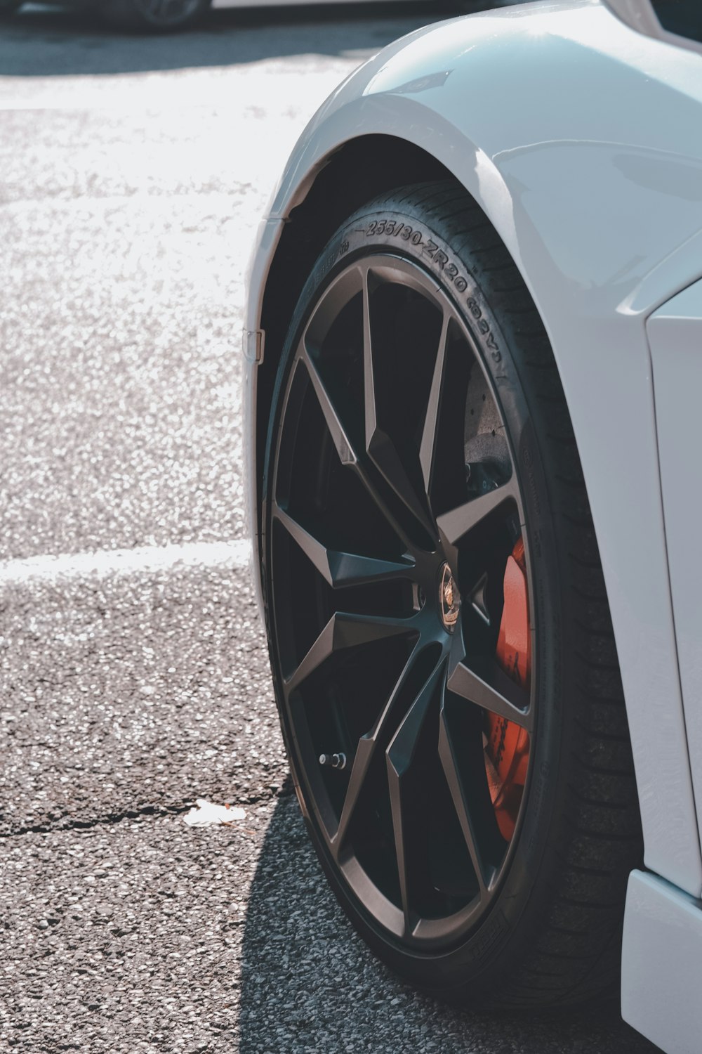 a close up of a car tire on a street