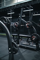 a gym with a row of exercise equipment