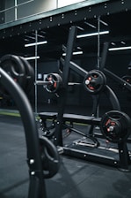 a gym with a row of exercise equipment