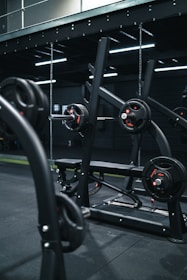 a gym with a row of exercise equipment