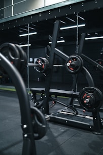a gym with a row of exercise equipment