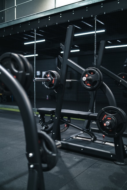 a gym with a row of exercise equipment