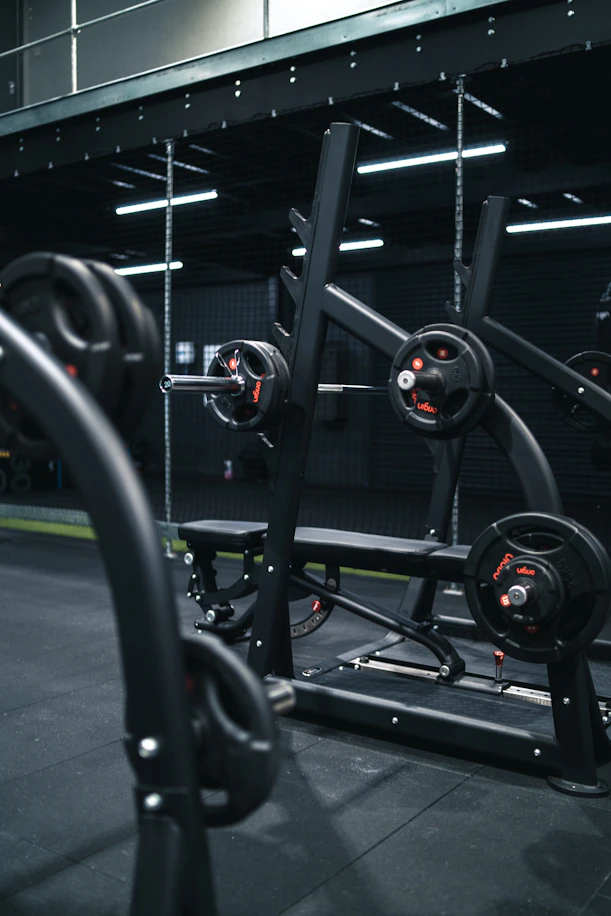 a gym with a row of exercise equipment