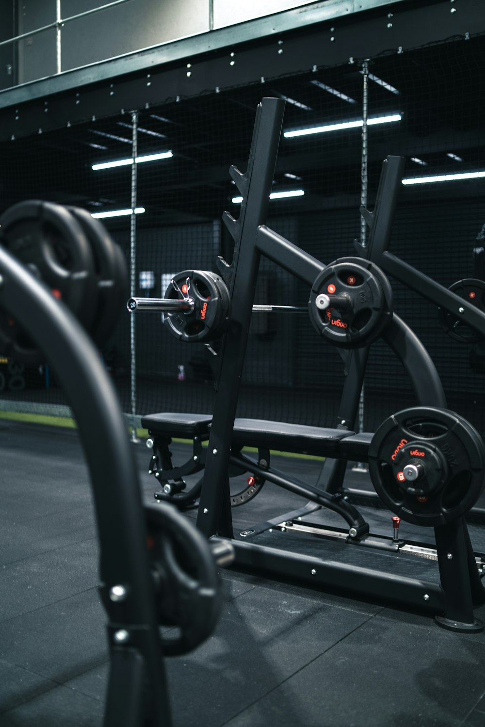 a gym with a row of exercise equipment