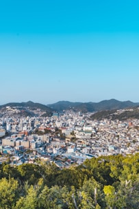 Plot with a backdrop of hills and a clear blue sky in Pune.