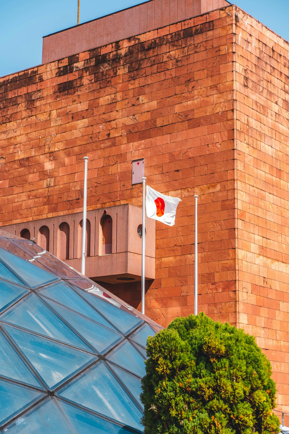 a red brick building with a flag on top of it