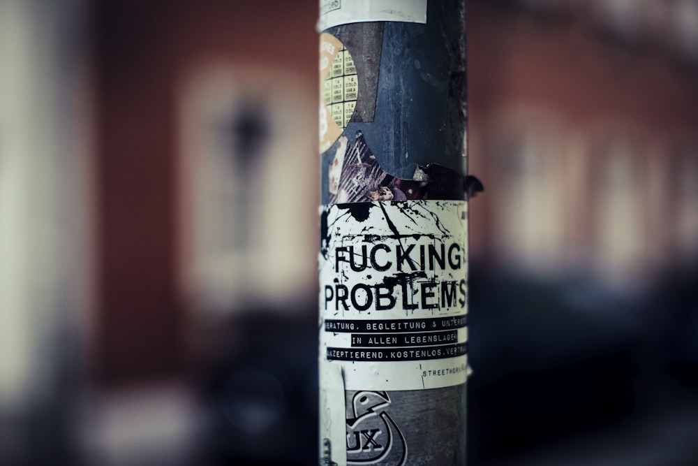 a close up of a sticker on a pole