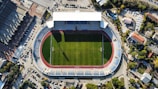 an aerial view of a soccer field in a city