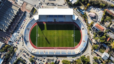 an aerial view of a soccer field in a city