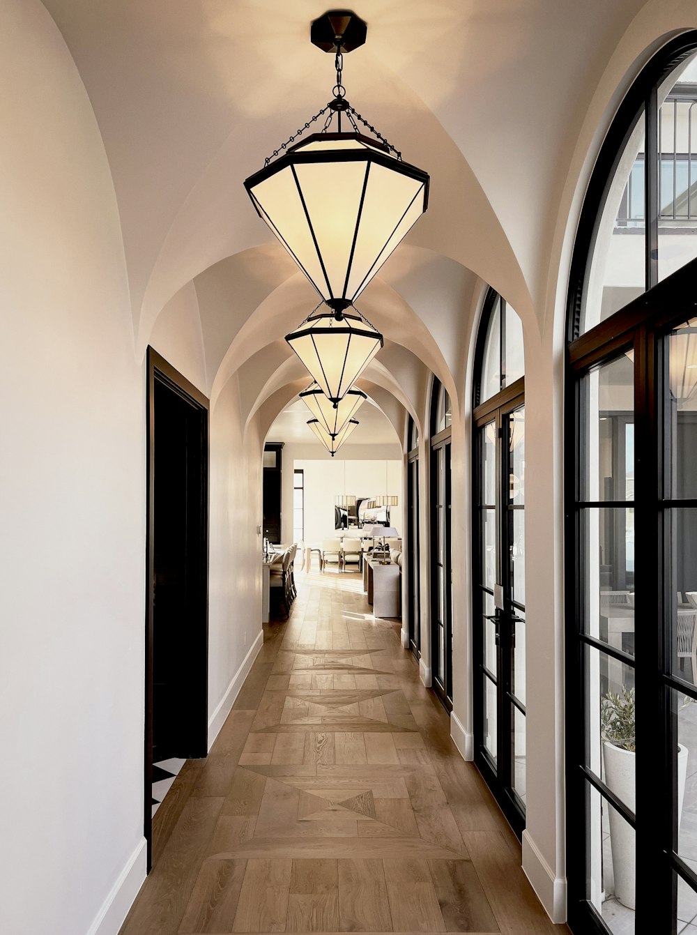 a long hallway with a light hanging from the ceiling