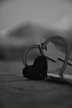 a pair of scissors and a heart shaped key