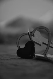 a pair of scissors and a heart shaped key