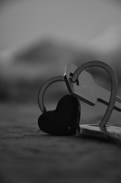 a pair of scissors and a heart shaped key