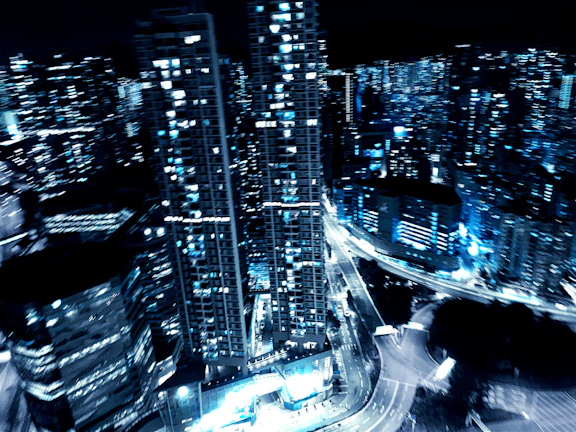 Nighttime cityscape illuminated by smart technology infrastructure, highlighting advanced engineering solutions.