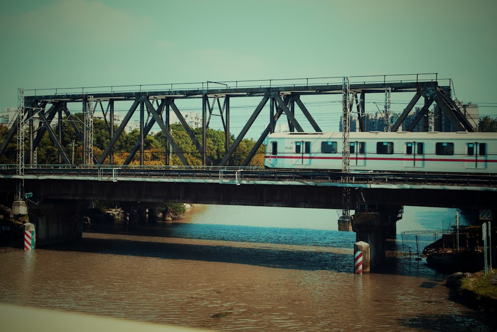 a train crossing a bridge over a river