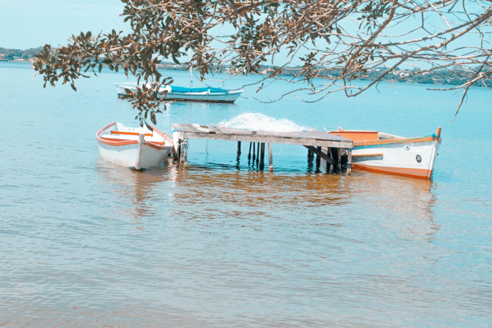 a couple of boats that are sitting in the water