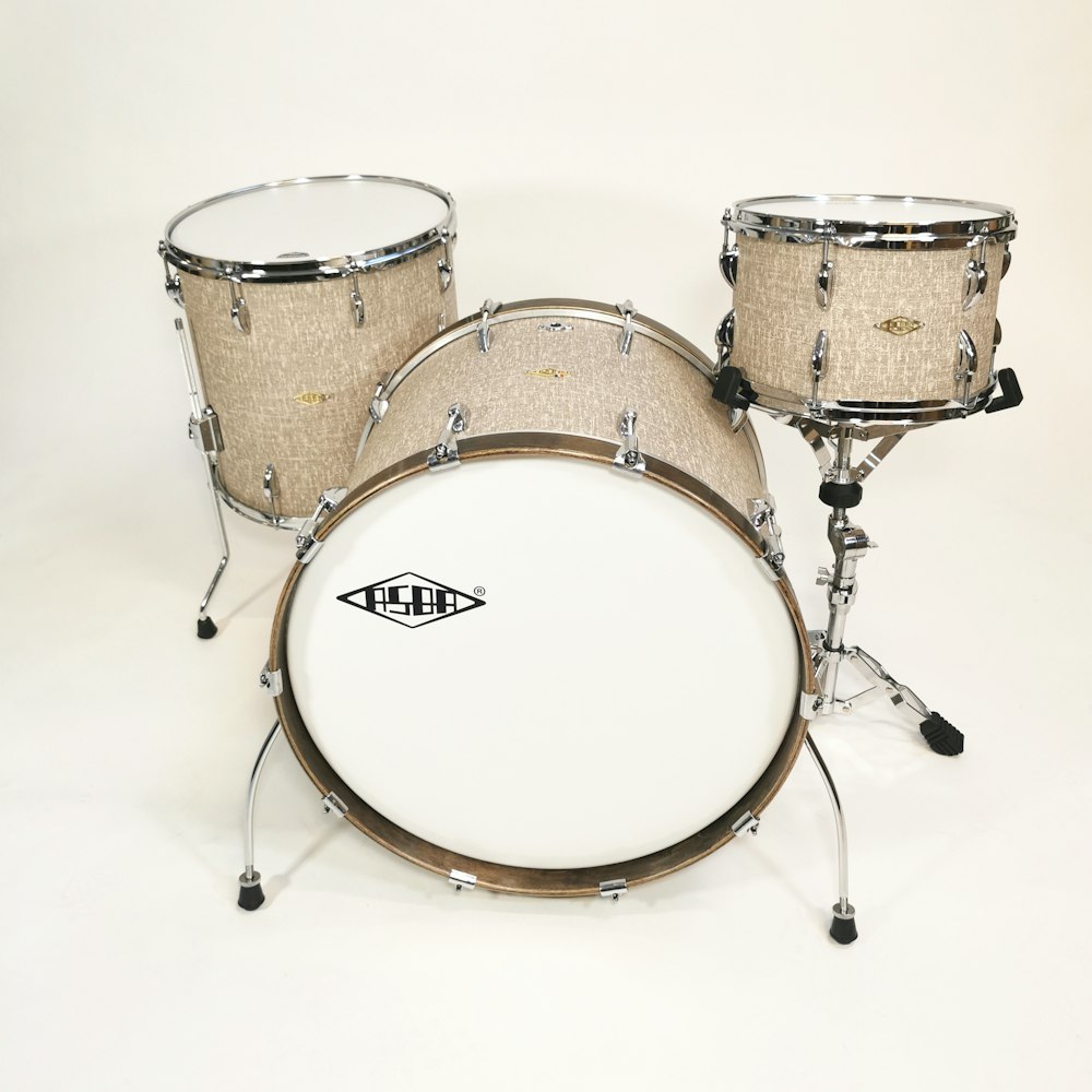 a set of drums with a white background