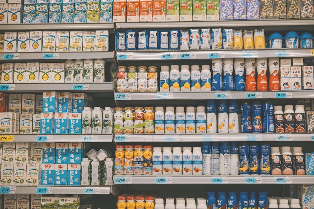 a display in a grocery store filled with lots of milk