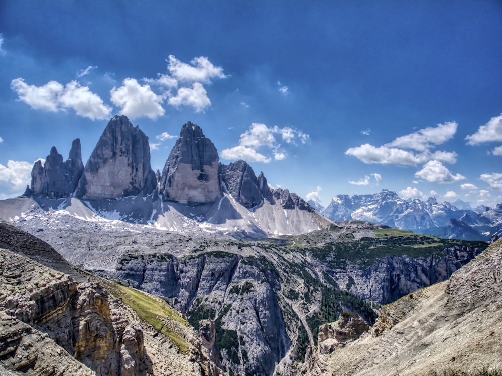 a group of mountains with a blue sky in the background