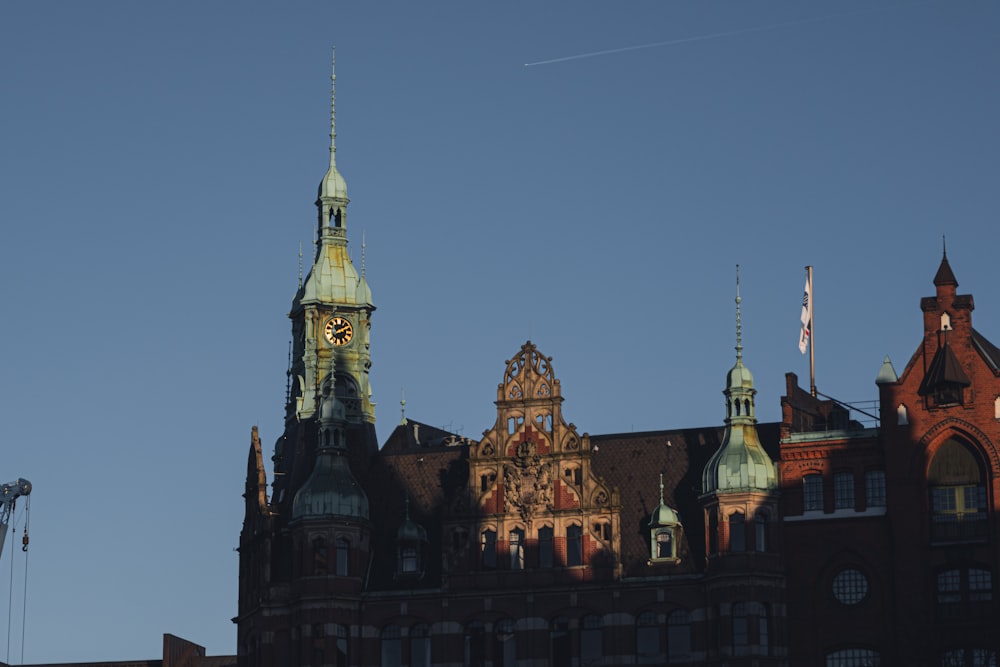 a tall building with a clock on the top of it